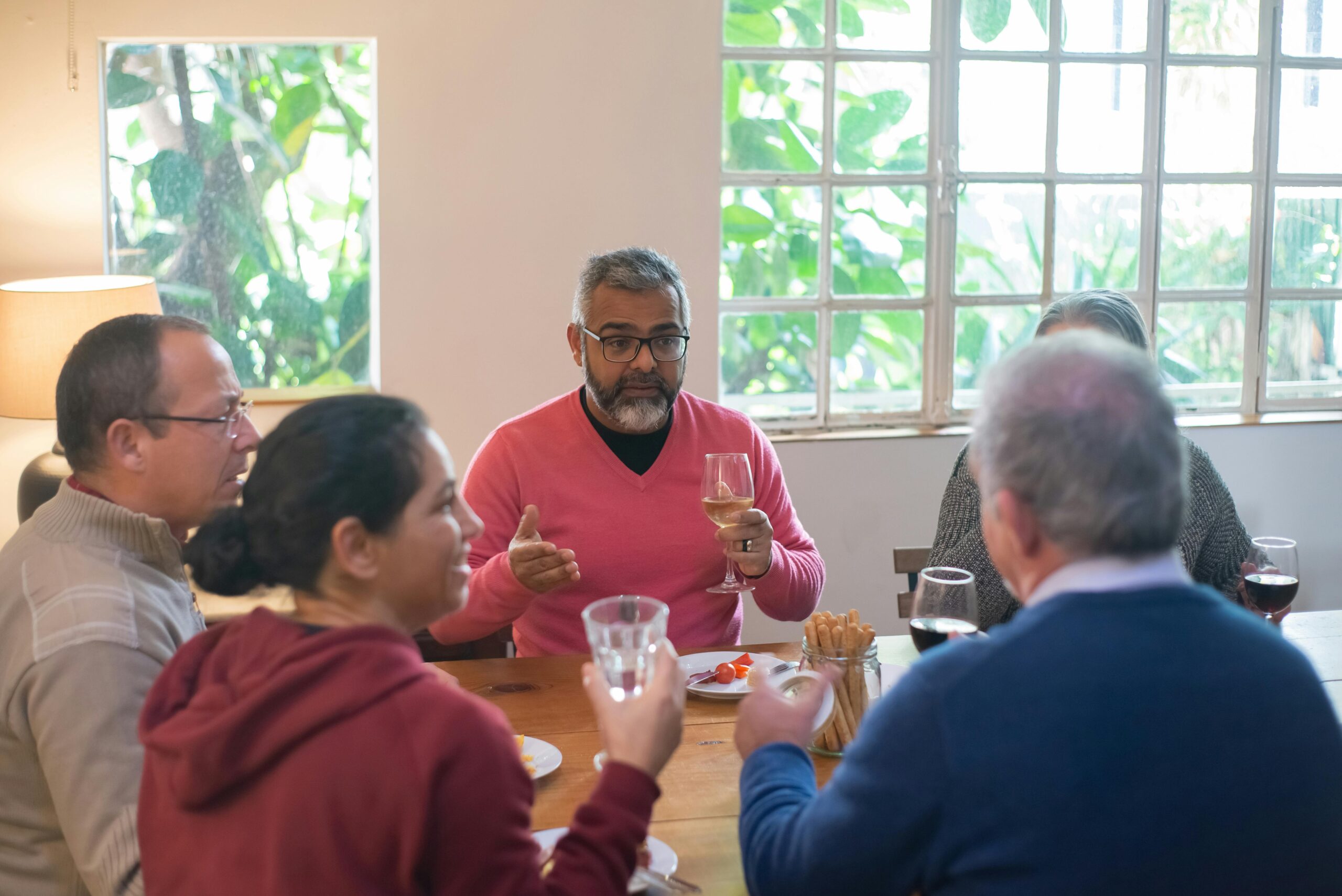Guests enjoying wine together at a relaxed gathering