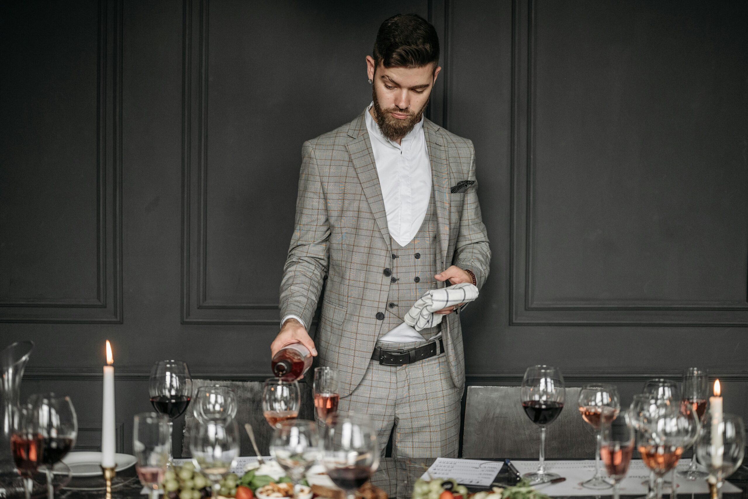 A server pouring wine into a glass during a tasting