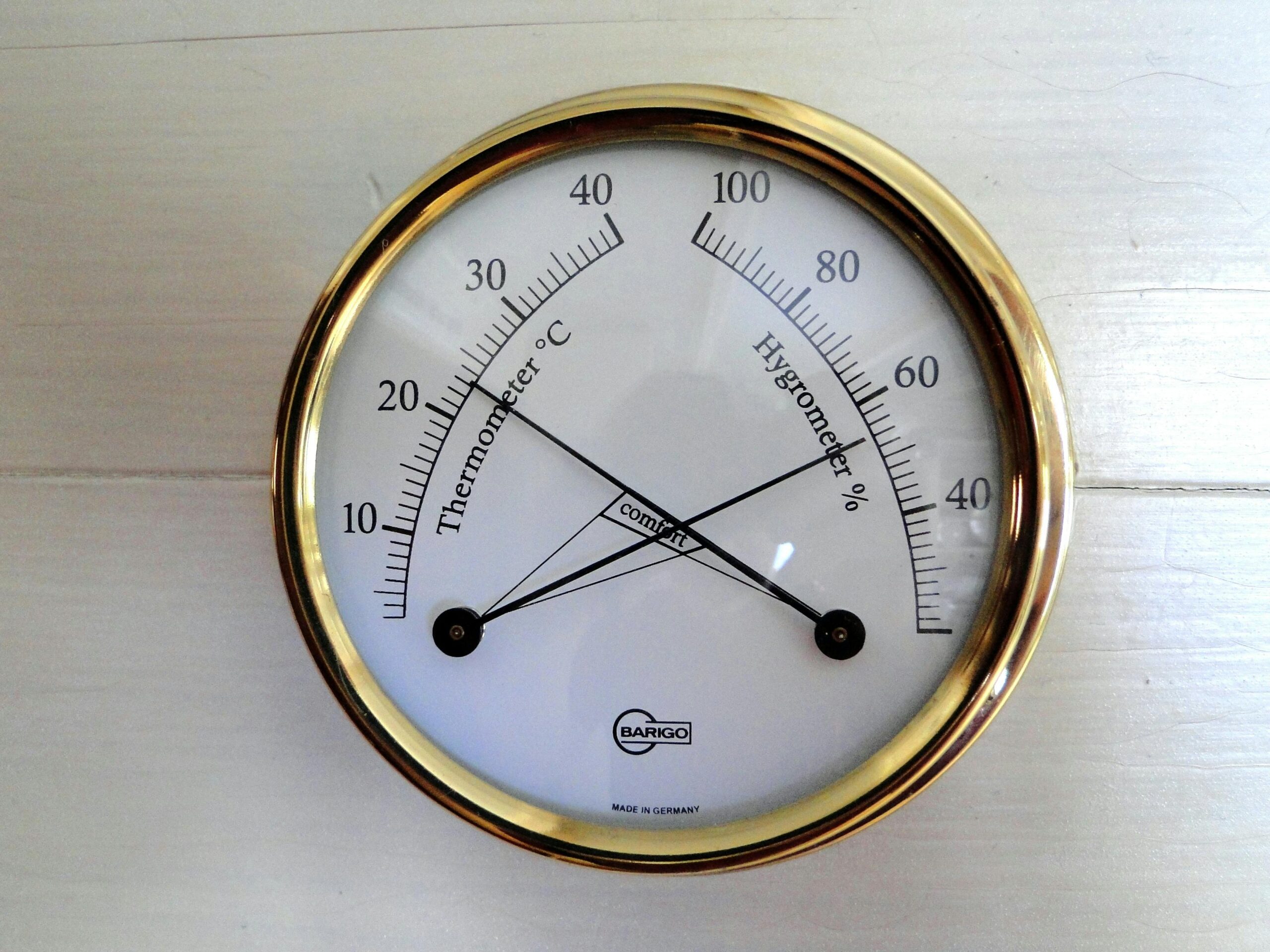 A temperature and humidity monitor representing stable wine storage conditions