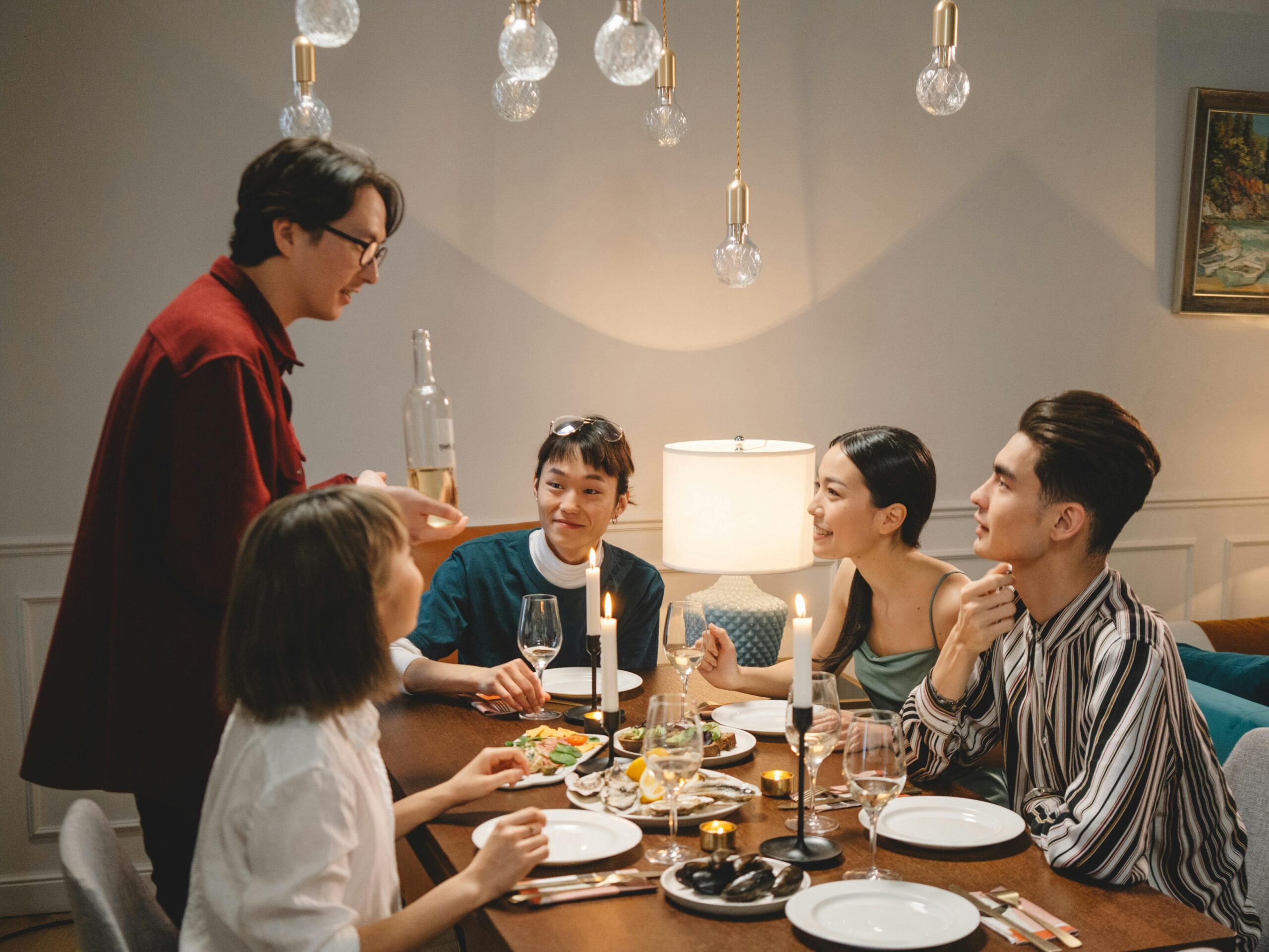 A relaxed hosting moment with wine on the table that feels welcoming, simple, and unpretentious