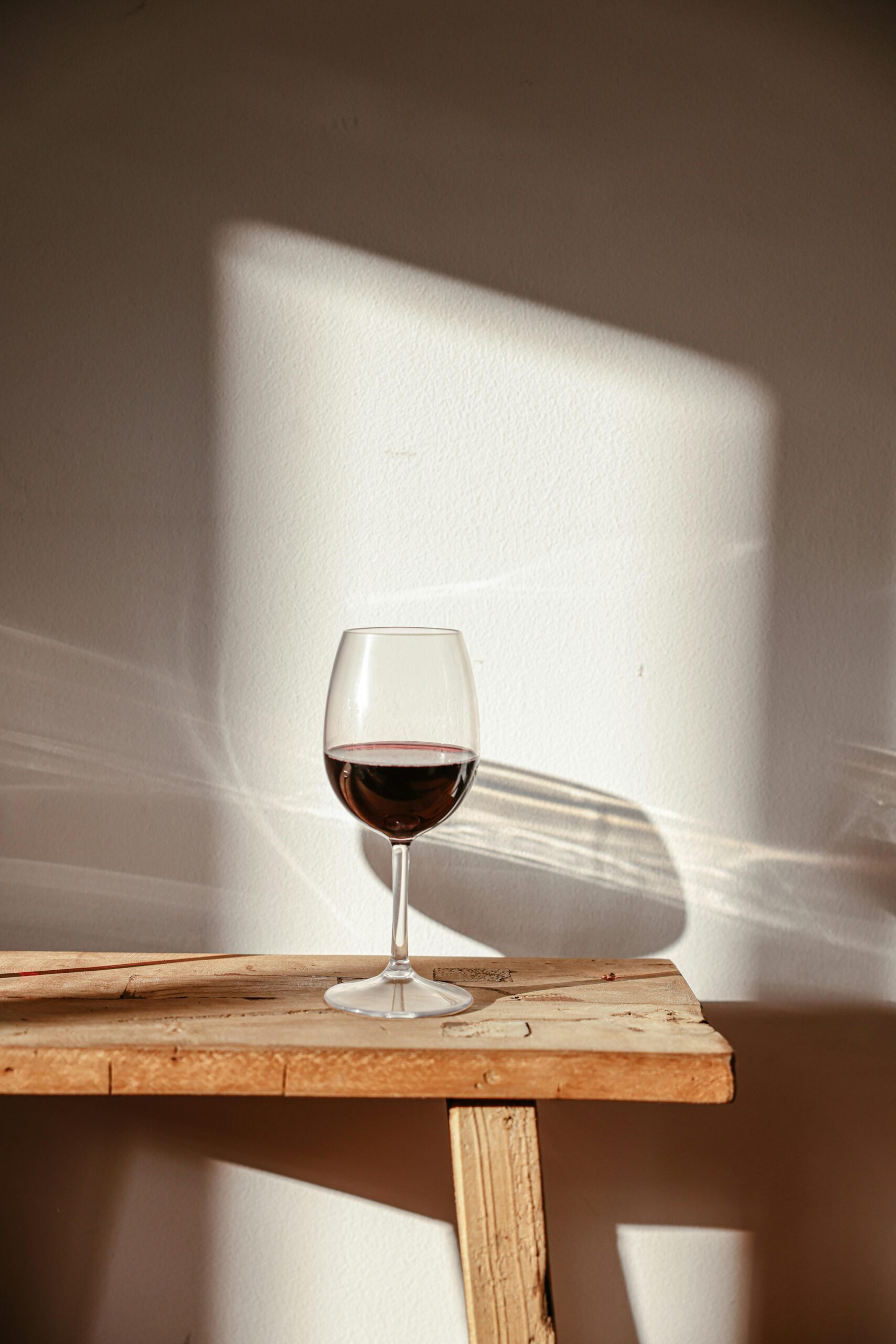 A calm wine moment at home with two people sharing a glass
